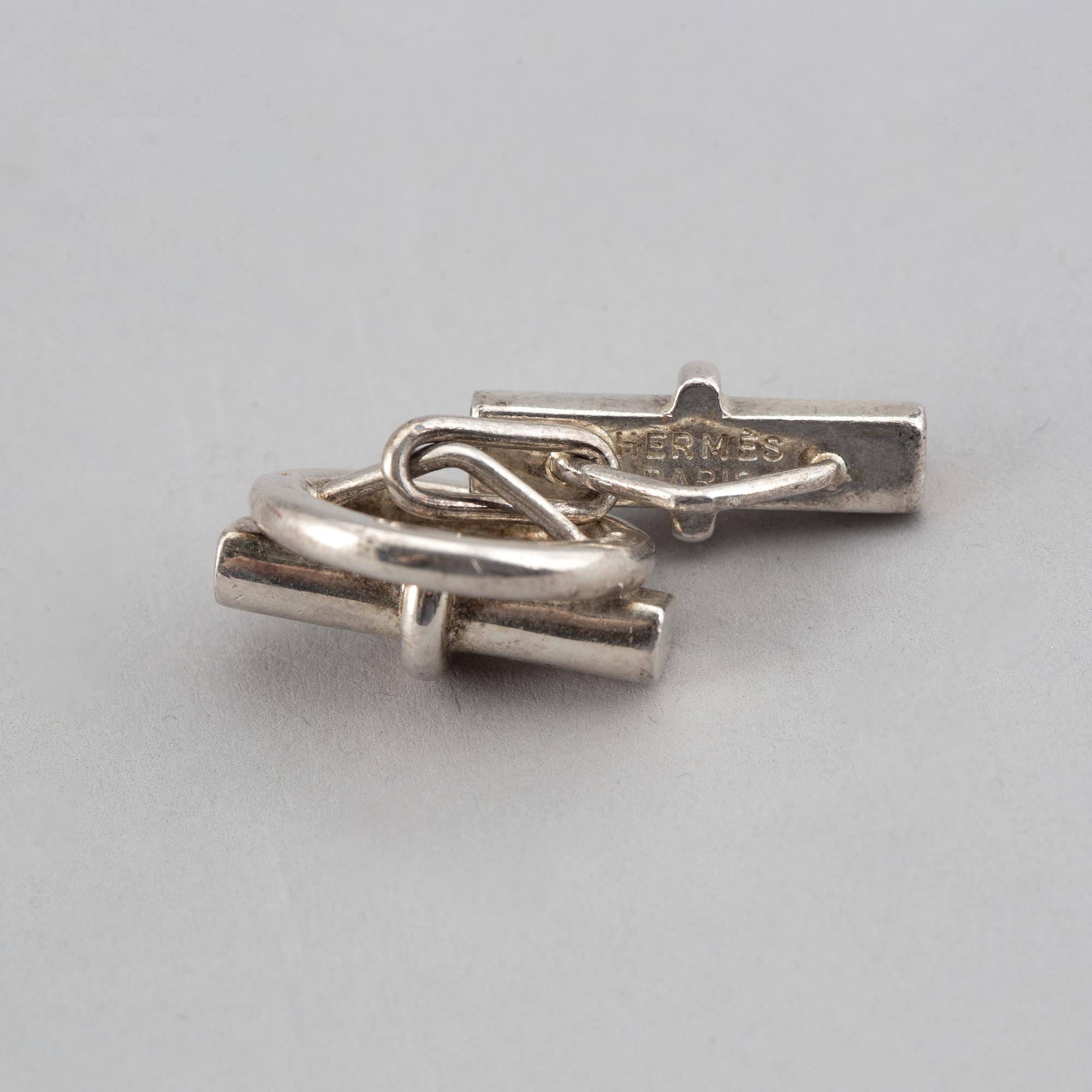 HERMÈS, a pair of silver cuff links.