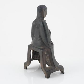 A bronze sculpture of a seated deity, Ming style, probably 20th Century.