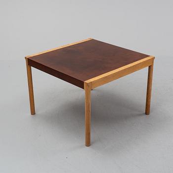 An oak and leather coffee table, mid 20th Century.