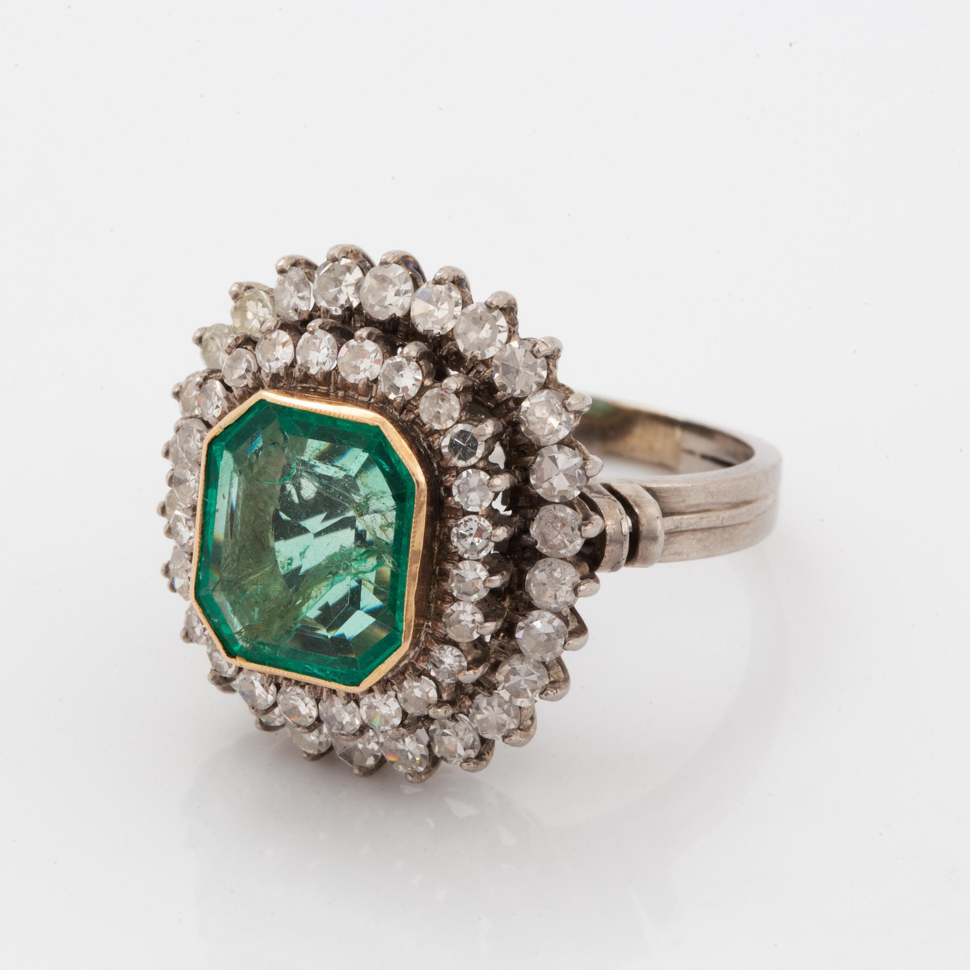 Emerald-cut emerald and eight-cut diamond ring.