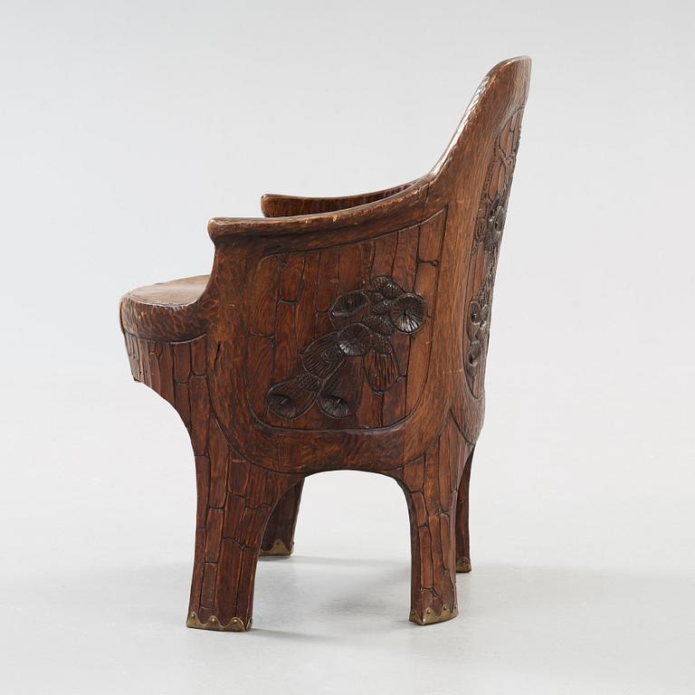 A Gustav Fjaestad Art Nouveau carved pine chair, 'Stabbestol', by Adolf Swanson, Arvika, Sweden 1908.