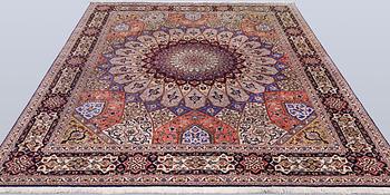 A Tabriz carpet, part silk, so-called 50 Raj, approx. 255 x 200 cm.