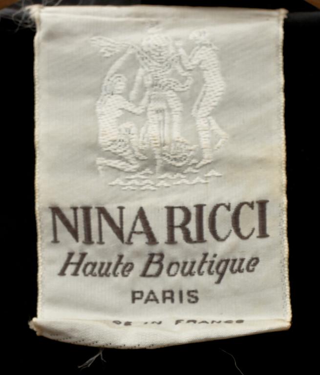 NINA RICCI, a black velvet dress.