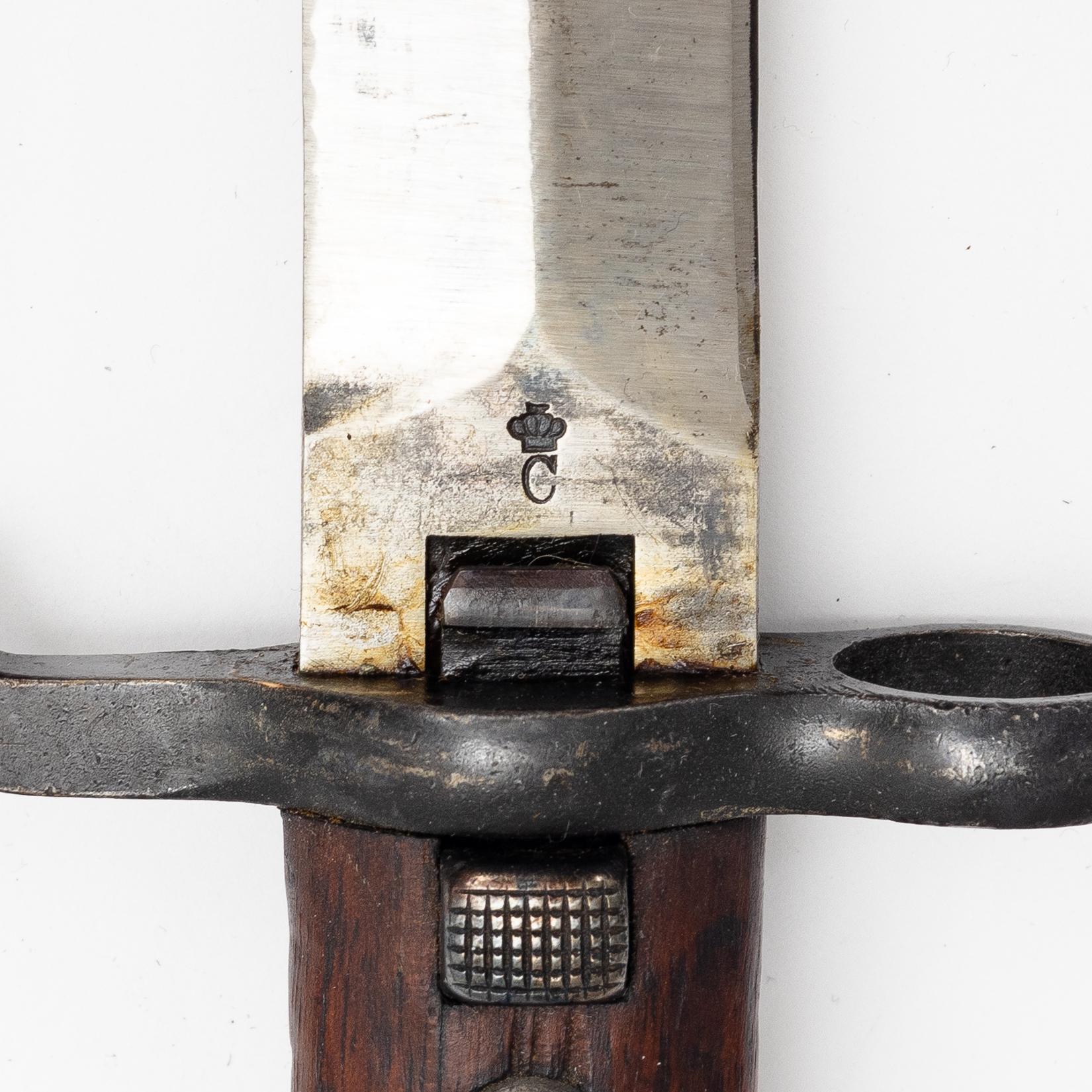 Three Swedish bayonets with scabbards.