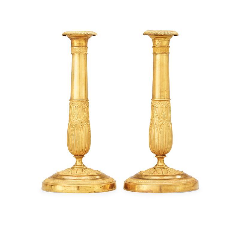 A pair of French Empire early 19th century candlesticks.