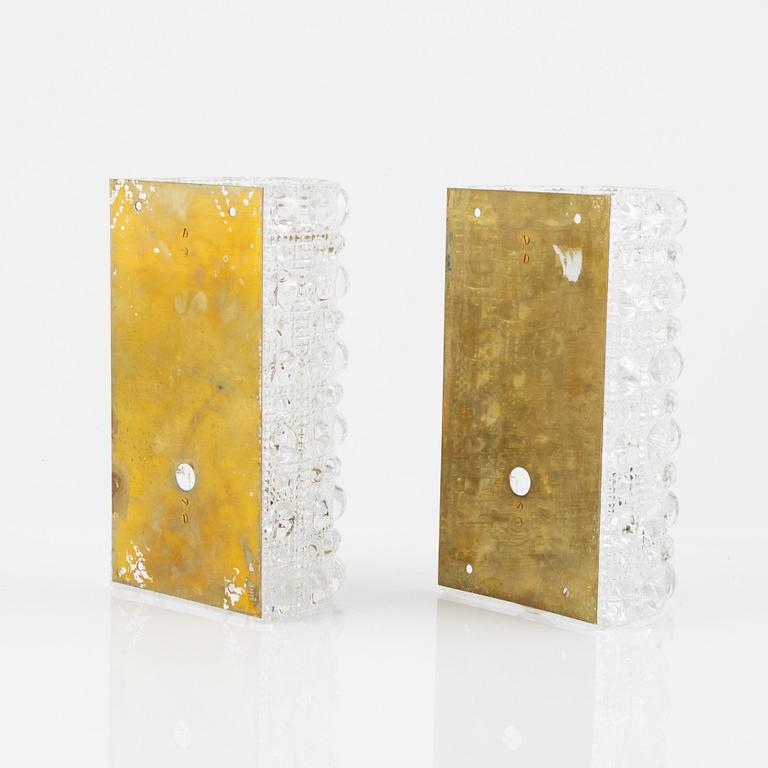 Carl Fagerlund, a pair of brass and glass wall lights, Orrefors, 1960's.