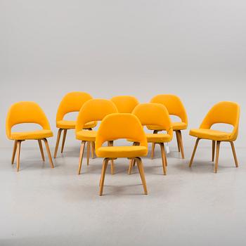 A group eight of Eero Saarinen executive side chair with wood legs, Knoll Products inc.