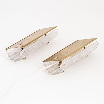Carl Fagerlund, a pair of brass and glass wall lights, Orrefors, 1960's.
