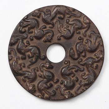 A group of three archaistic Chinese stone bi discs and two pendants.