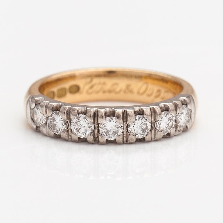 Sormus, 18K kultaa ja timantteja n. 0.57 ct yht. Helkelä Oy Kultasepänliike, Rauma 2004.