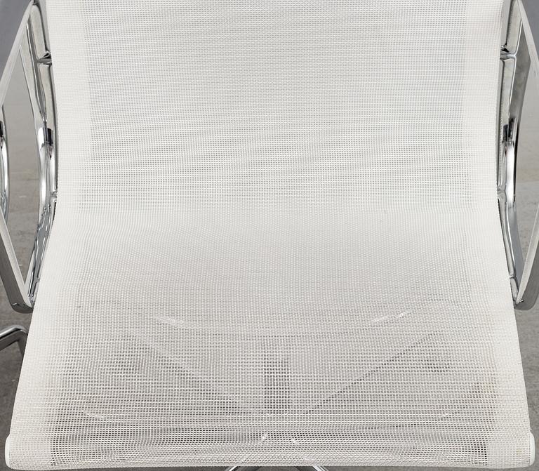 A pair of 'EA 108' desk chairs by Charles & Ray Eames for Vitra.