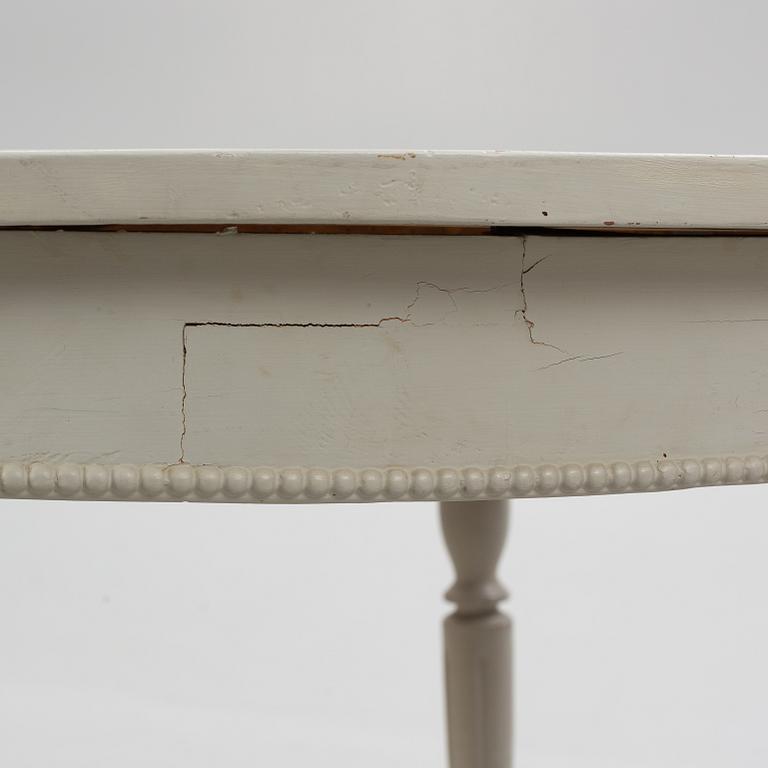 A late 19th Century painted dining table.