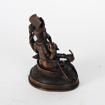 A Nepalese bronze deity, 20th century.