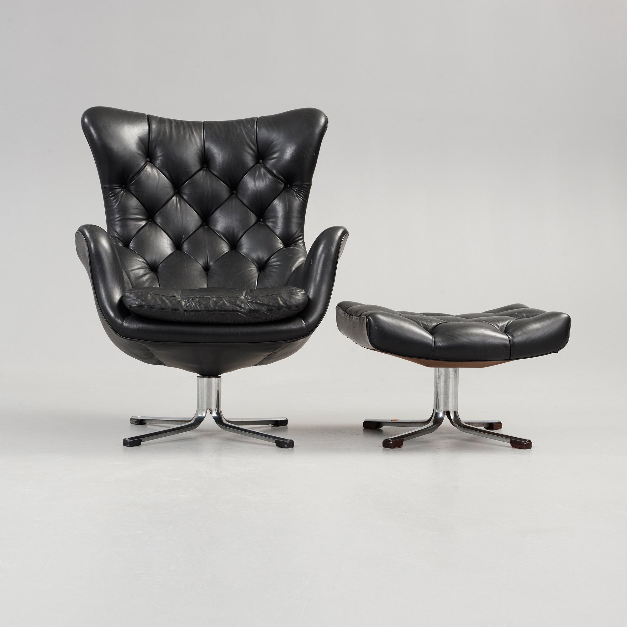 A Gustav Axel Berg 'Status' black leather easy chair with ottoman, Bröderna Andersson 1960's-70's.