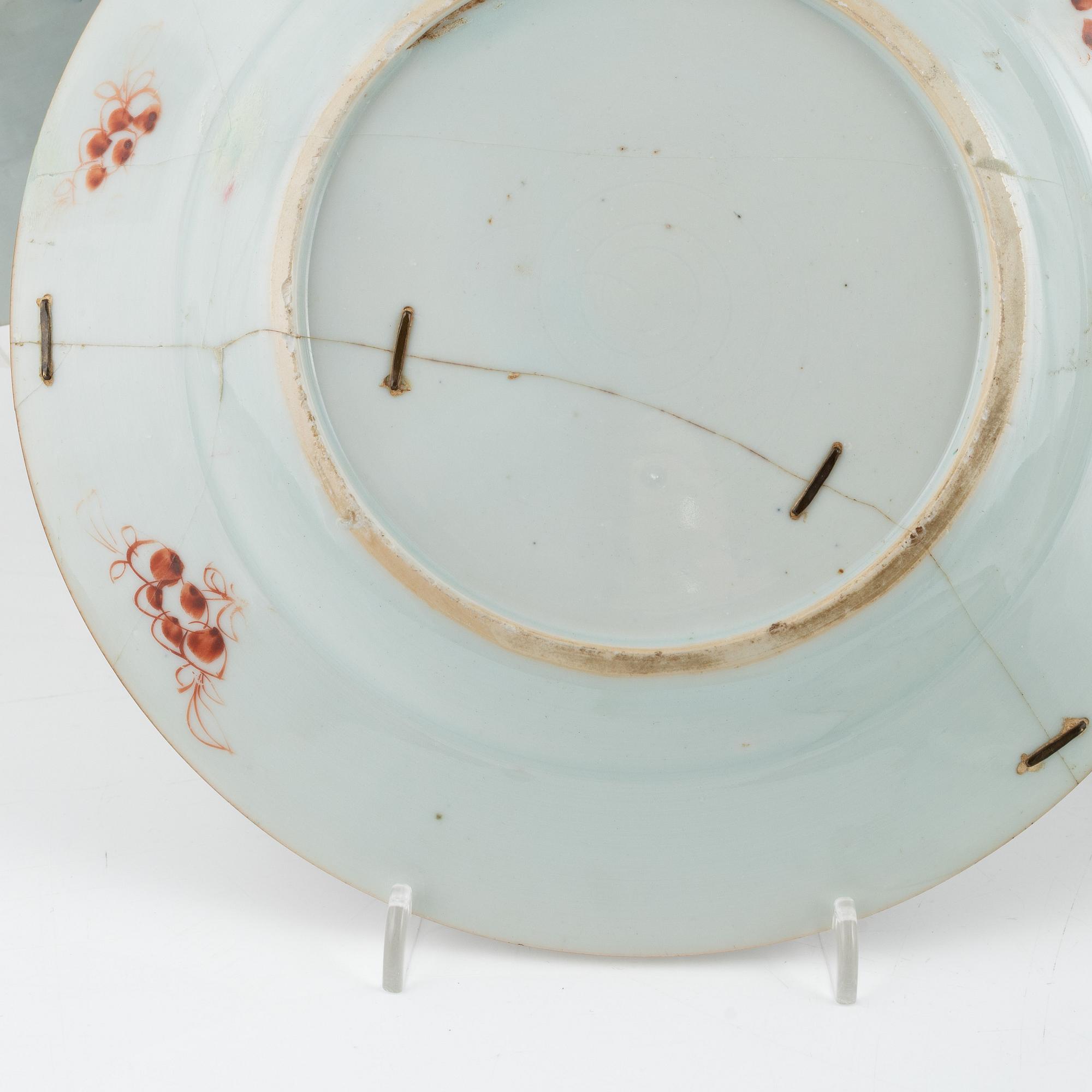 Six Famille Rose plates, and a blue and white dessert dish, China, 18th century.
