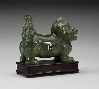 A nephrite figure of a Buddhist Lion, late Qing dynasty.