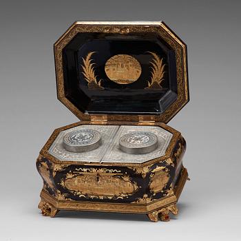 553. A lacquered tea box with pewter canisters, Qing dynasty, late 19th Century.