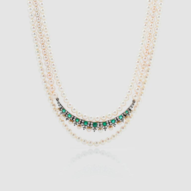 A 3-strand cultured pearl necklace with an emerald, cultured pearl and diamond brooch.