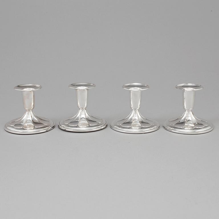 A set of four silver Candlesticks,