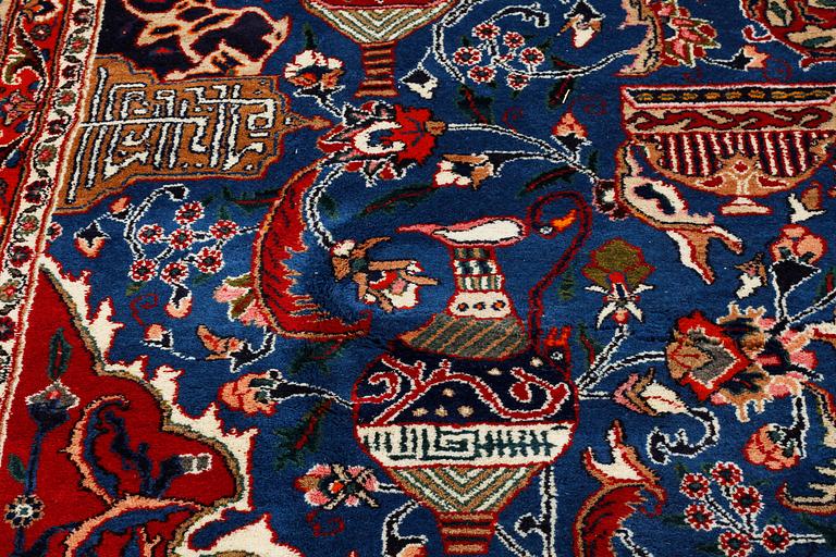 A SIGNED KASHMAR RUG, 389 x 289 cm.