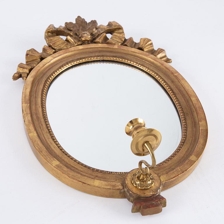 A pair of gilt Gustavian style mirror wall sconces, Stockholm, mid 20th Century.