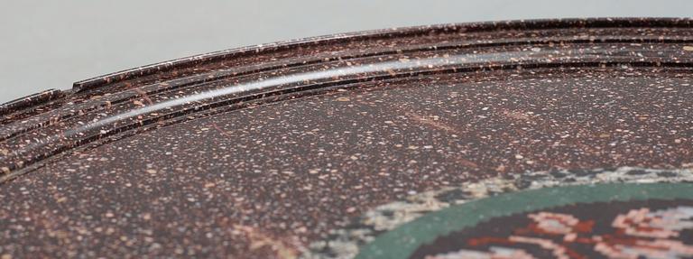 A Swedish 1830/40's porphyry table top. Later Empire-style mahogany veneer stand.