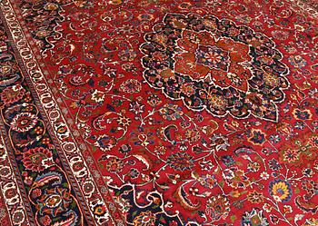 A signed Mashad carpet, ca 375 x 303 cm.