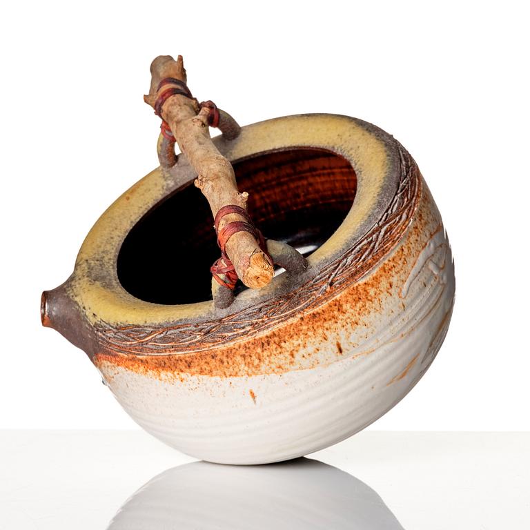 Iskandar Jalil, a stoneware vessel with wooden handle, Singapore 1970s-80s.