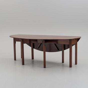 A DINING TABLE, England, made for NK, Nordiska Kompaniet, Sweden. Signed with label. Probably 1960s / 70s.