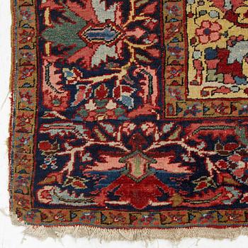 A semi-antique/old Heriz carpet, c 348 x 264 cm.