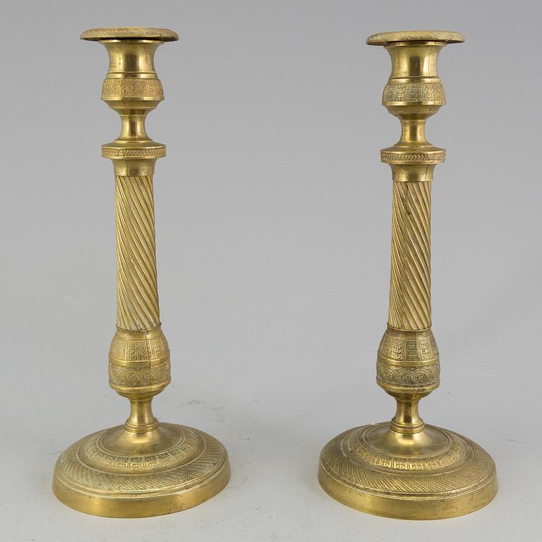 A pair of 'Empire' candlesticks, probably French.