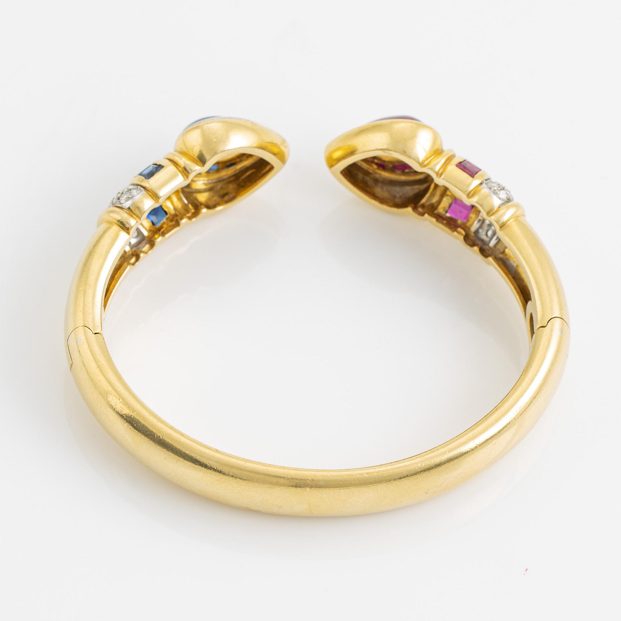 Heart shaped ruby and sapphire and brilliant cut diamond bangle.