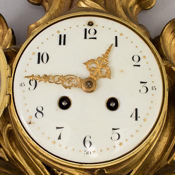 A  rococo-style wall clock around 1900.