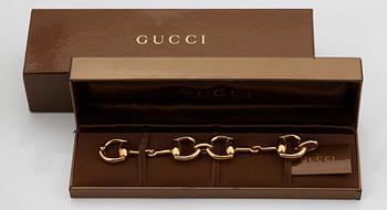 An 18K gold Gucci bracelet.
