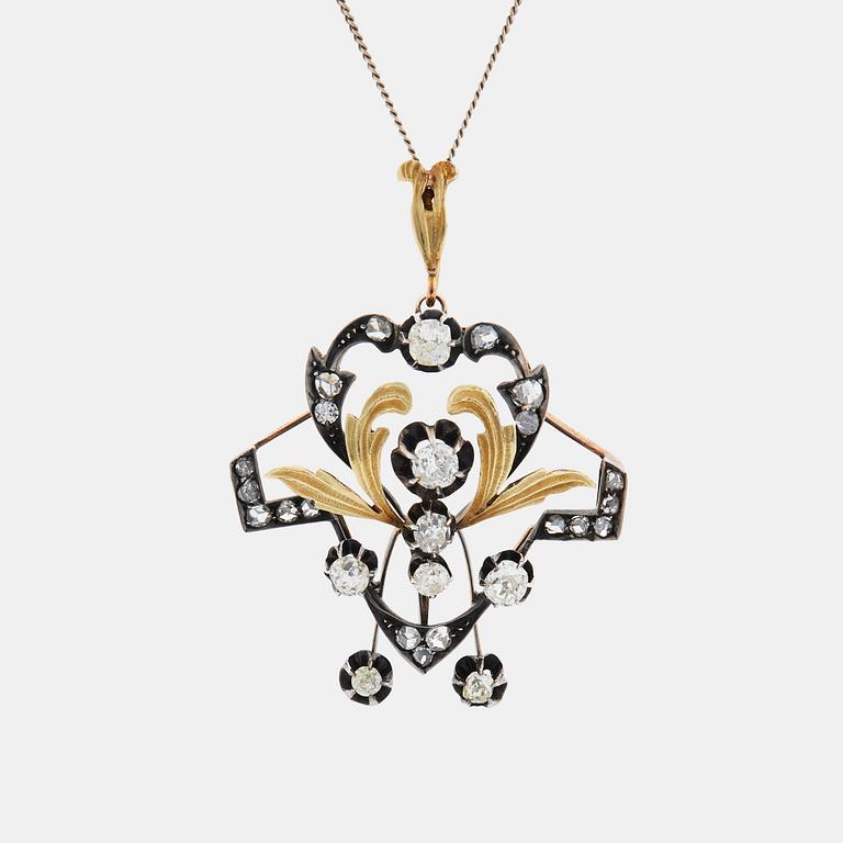 A 14K gold and silver pendant set with old- and rose-cut diamonds.