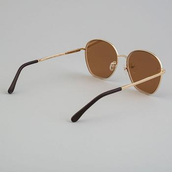 Sunglasses by Chanel.