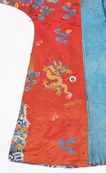 An embroidered red ground five clawed dragon 'female' formal robe, Qing dynasty, 19th century.