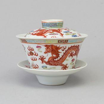 A Chinese 20th century famille rose porcelain cup with cover and dish, with Guangxus six character mark.