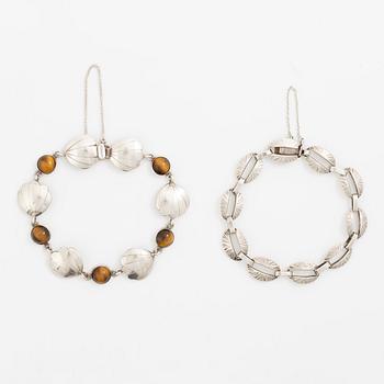 Victor Janson, two silver bracelets, one set with tiger's eye.