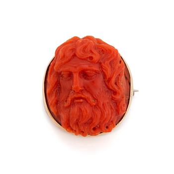 379. A 14K gold and coral cameo brooch.