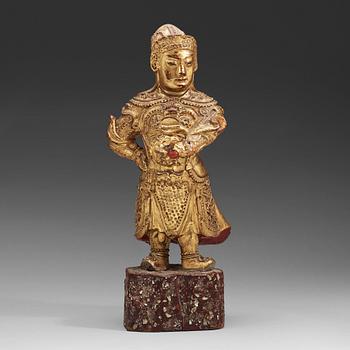 A wood sculpture of a guardian figure, (1644-1912).