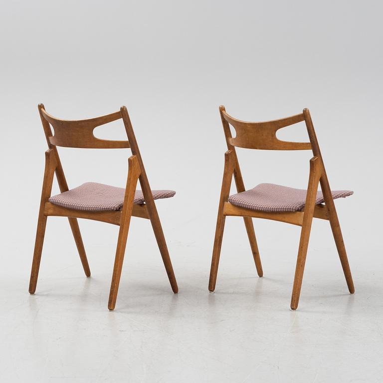A set of six model CH 29 'Savbukstolen' by Hans J Wegner, designed 1952.