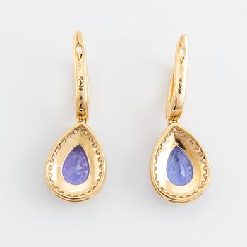 Pear shaped tanzanite and brilliant cut diamond earrings.