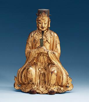 A gilt bronze figure of Confucius, Ming dynasty (1368-1644).