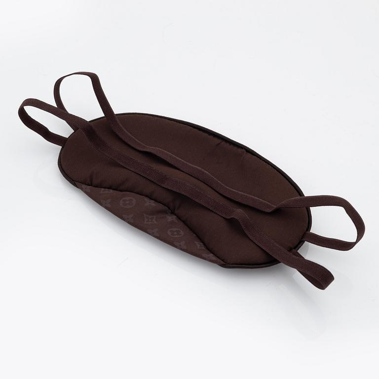 Louis Vuitton, a monogram "Trousse kit de voyage' travel kit with inflatible pillow and eye mask.