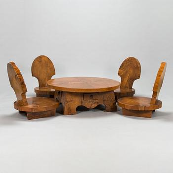 A 21st century  table and four chairs probably East Asia.