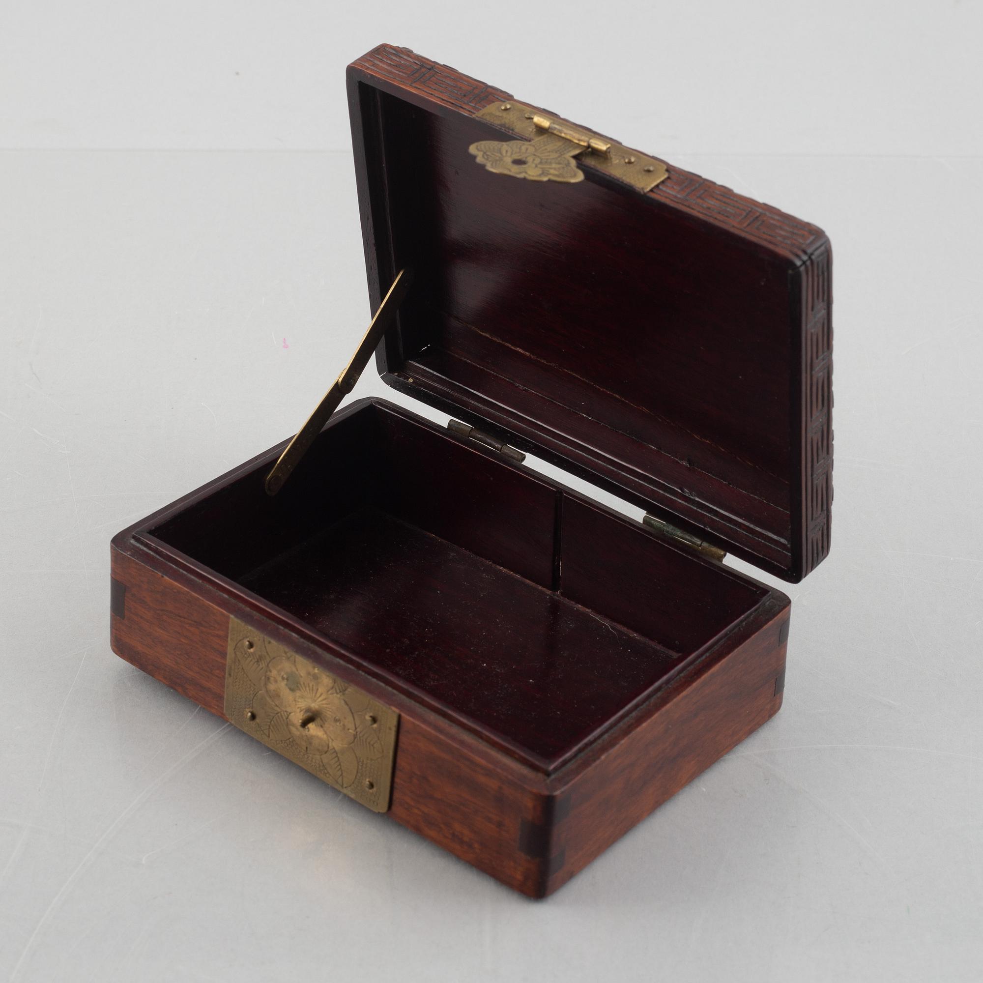 Two Chinese hardwood boxes with nephrite plaques, 20th century.