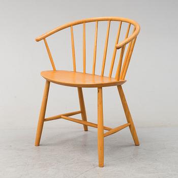 A 'J64' beech armchair by Ejvind A Johansson for co-op furniture.