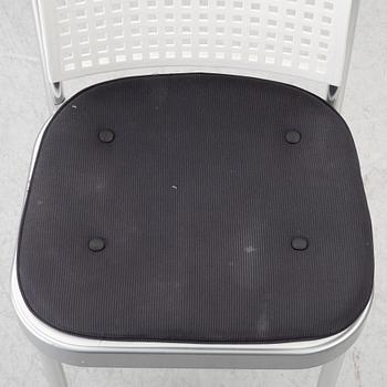 Vico Magistretti, a "Shine" dining table with twelve chairs, De Padova, Italy, around the year 2000.