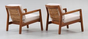 A pair of Carl Gustaf Hiort af Ornäs walnut armchairs, Finland 1950's.